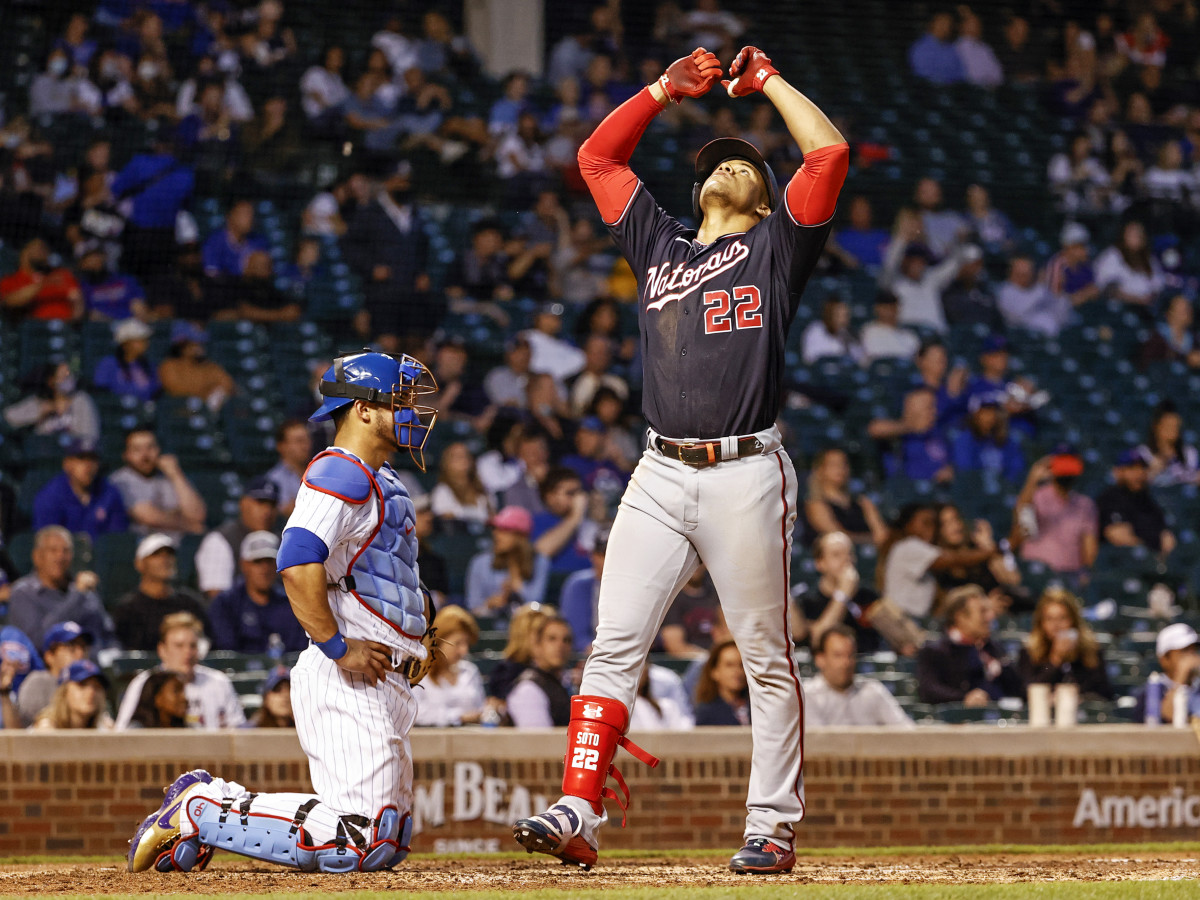 May 19, 2021; Chicago, Illinois, USA; Washington Nationals left fielder Juan Soto (22) crosses home plate after hitting a solo home run against the Chicago Cubs during the fifth inning at Wrigley Field.